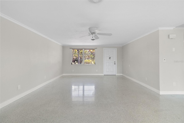unfurnished room featuring speckled floor, ornamental molding, baseboards, and ceiling fan