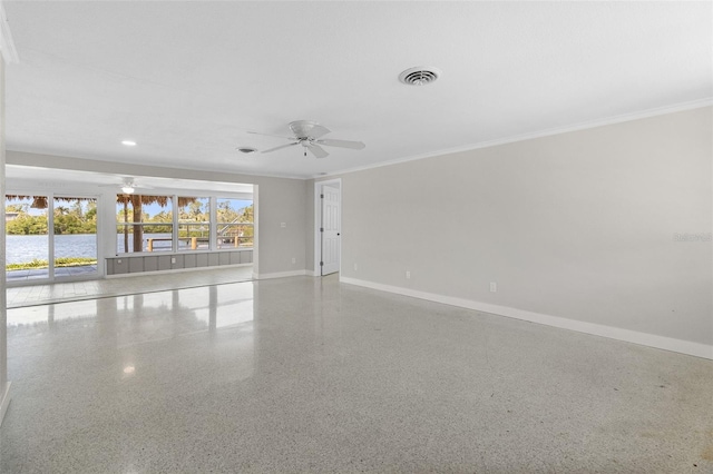 empty room with baseboards, visible vents, speckled floor, a ceiling fan, and ornamental molding