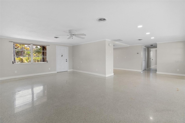unfurnished room featuring light speckled floor, crown molding, baseboards, and ceiling fan