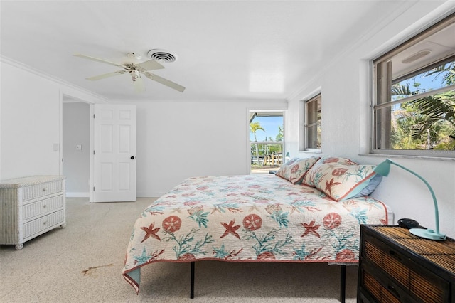 bedroom with a ceiling fan, baseboards, crown molding, and visible vents