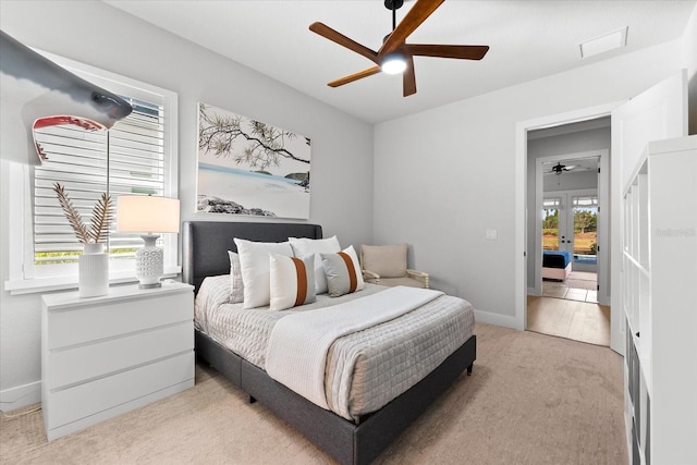 bedroom featuring visible vents, baseboards, ceiling fan, carpet flooring, and french doors