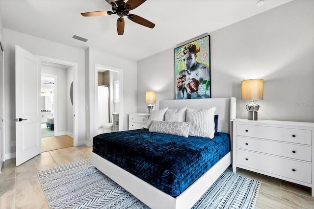 bedroom with visible vents, ceiling fan, ensuite bathroom, and baseboards