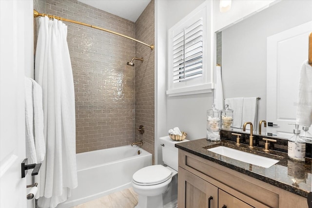 full bathroom featuring vanity, toilet, and shower / bath combo with shower curtain