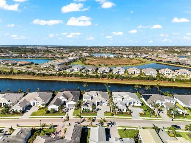 aerial view featuring a residential view and a water view