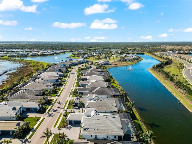 bird's eye view featuring a residential view and a water view