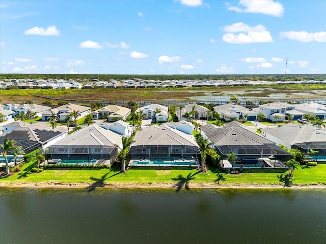 aerial view with a residential view and a water view