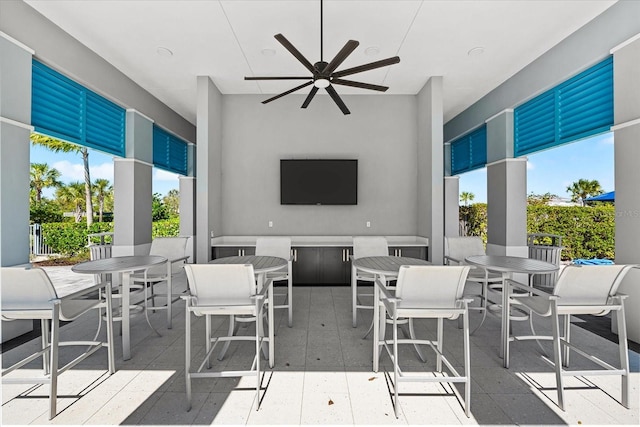 view of patio with outdoor dining space and ceiling fan