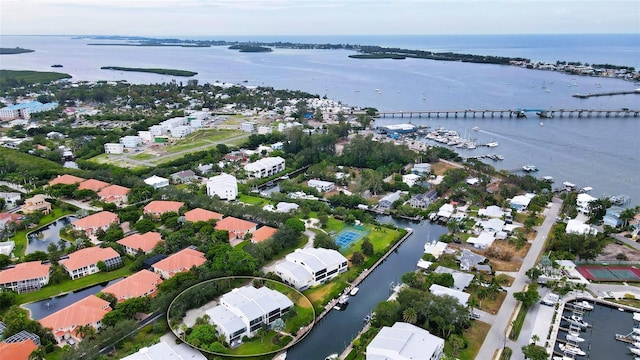 drone / aerial view with a residential view and a water view