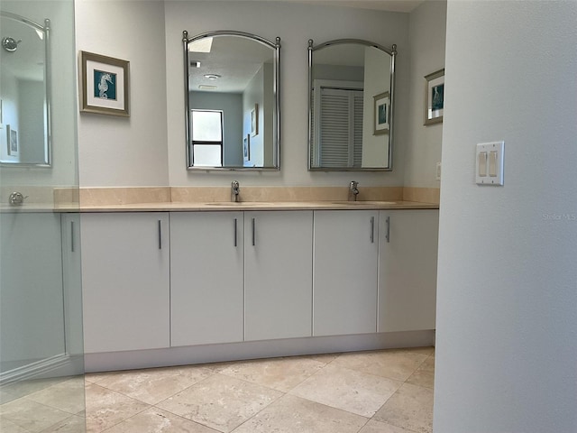 full bath with double vanity and a sink