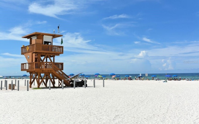 property view of water featuring a beach view