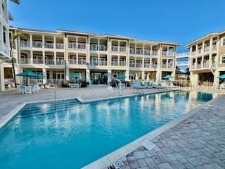 community pool featuring a patio area