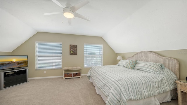 bedroom featuring vaulted ceiling, carpet, baseboards, and ceiling fan