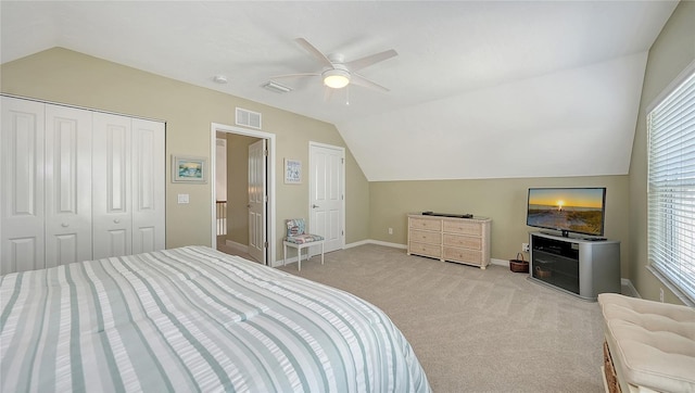 bedroom with visible vents, lofted ceiling, carpet floors, baseboards, and ceiling fan