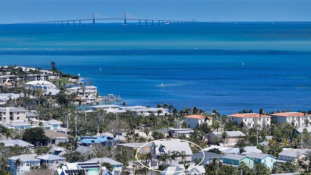 drone / aerial view featuring a water view and a residential view