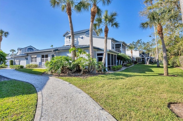 view of side of home with a lawn