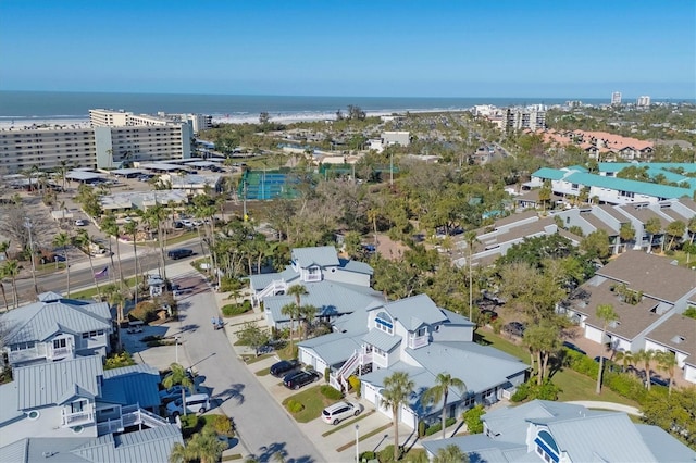 birds eye view of property featuring a water view and a residential view