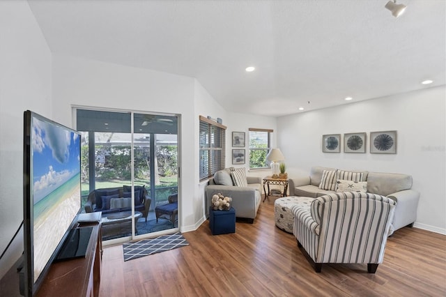 living room featuring recessed lighting, wood finished floors, and baseboards