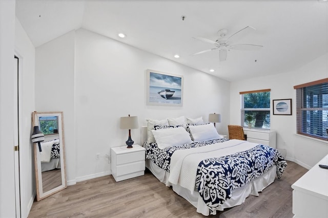 bedroom with recessed lighting, baseboards, light wood-style floors, and vaulted ceiling