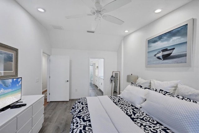 bedroom with a ceiling fan, lofted ceiling, recessed lighting, and wood finished floors