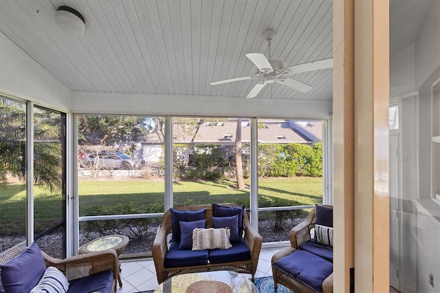 sunroom featuring ceiling fan and vaulted ceiling