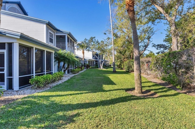 view of yard with a sunroom