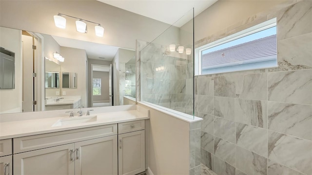 full bath featuring vanity and a walk in shower