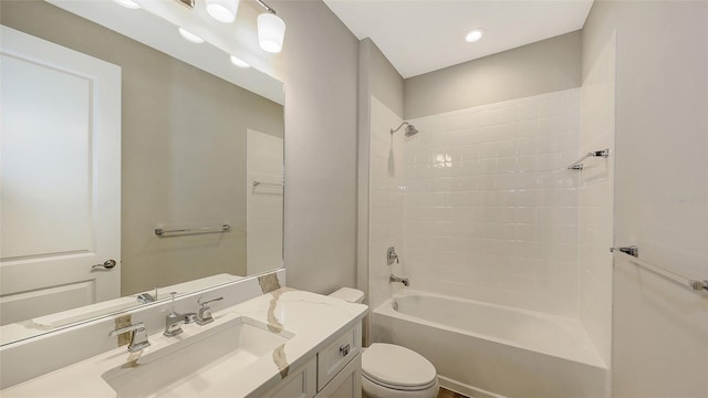 bathroom with vanity, toilet, and shower / bath combination