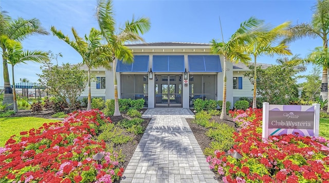 entrance to property featuring french doors