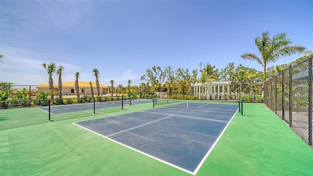 view of sport court featuring fence