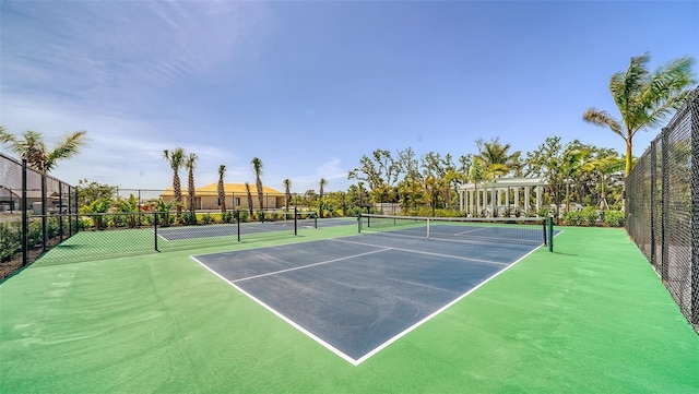 view of sport court featuring fence