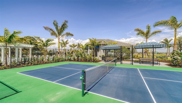 view of tennis court with fence