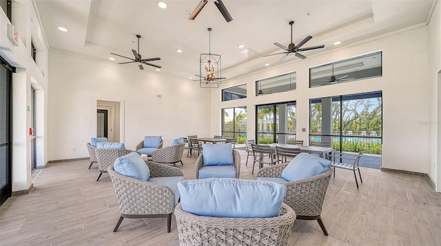 interior space featuring an outdoor living space and a ceiling fan