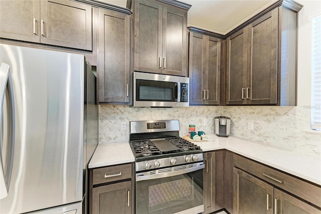 kitchen featuring stainless steel appliances, dark brown cabinets, and decorative backsplash