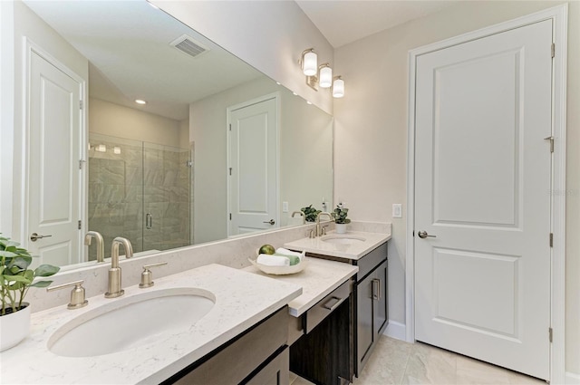 bathroom featuring visible vents, a shower stall, vanity, and baseboards