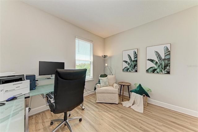 home office featuring wood finished floors and baseboards