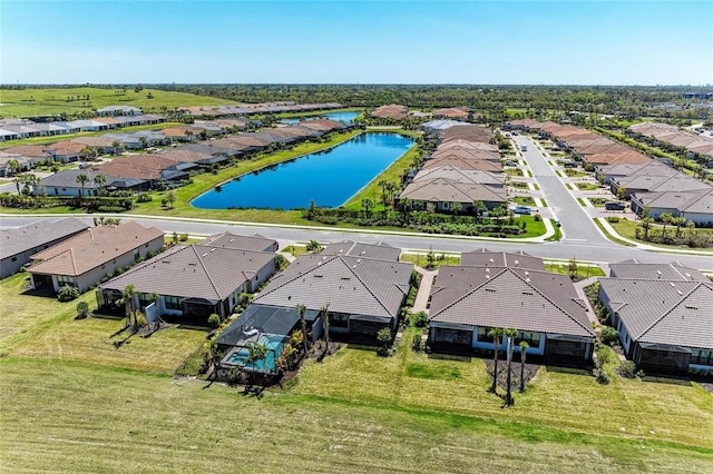 aerial view with a residential view and a water view