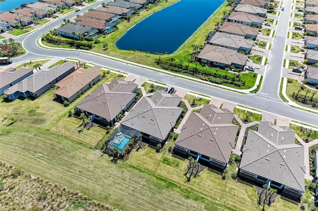 bird's eye view featuring a residential view and a water view