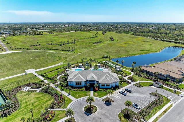 birds eye view of property with a water view