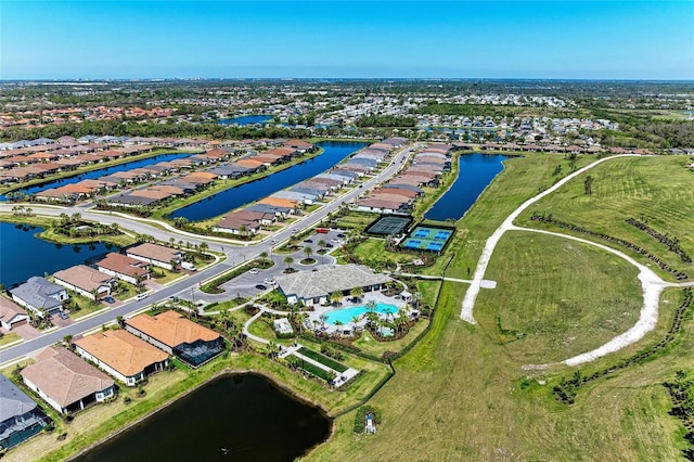 birds eye view of property with a residential view and a water view