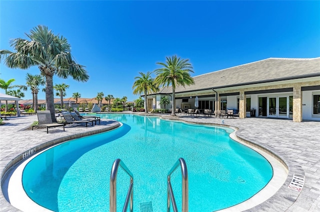 community pool featuring a patio area