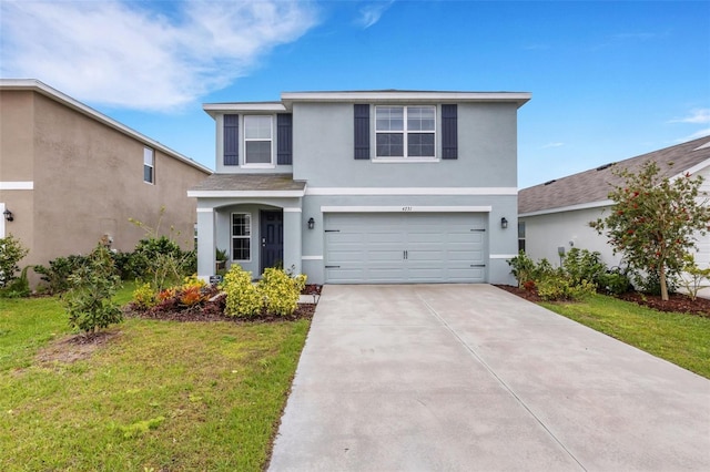 traditional-style home featuring a garage, stucco siding, driveway, and a front lawn