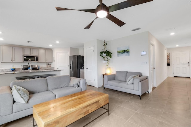 living area featuring recessed lighting, visible vents, ceiling fan, and light tile patterned floors