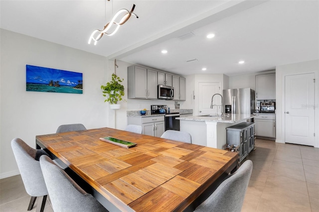 dining space with light tile patterned floors, an inviting chandelier, and recessed lighting