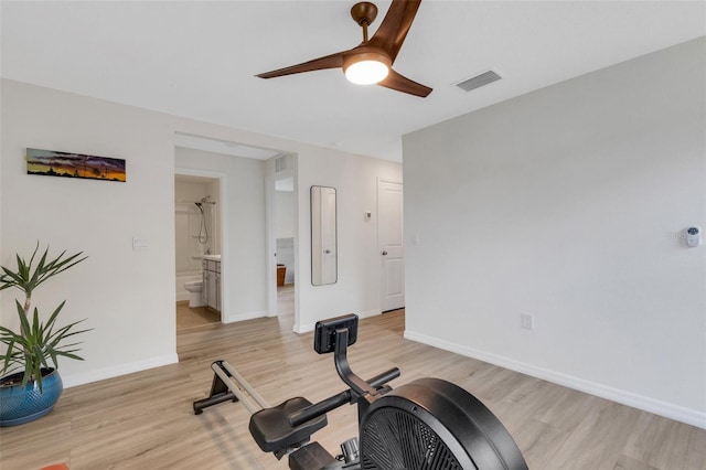 workout room with visible vents, baseboards, a ceiling fan, and light wood finished floors