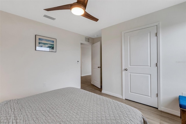 unfurnished bedroom with visible vents, baseboards, ceiling fan, and light wood finished floors