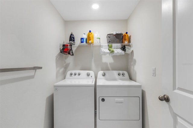 laundry room with laundry area and washer and clothes dryer