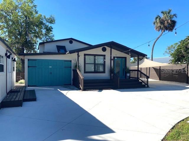 view of front of property featuring fence and stucco siding