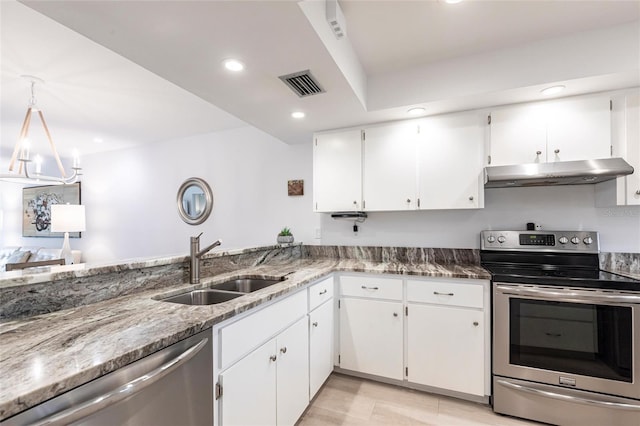 kitchen featuring under cabinet range hood, a sink, stainless steel appliances, white cabinets, and stone counters