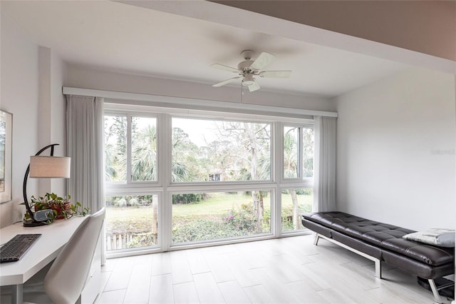 sitting room featuring a ceiling fan