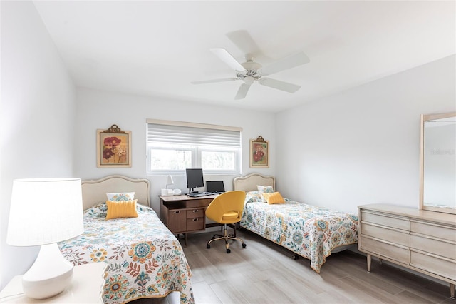 bedroom featuring a ceiling fan and wood finished floors